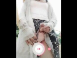 Super-cute Chinese t-girl in a public playground being sissy