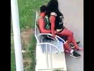 Ebony duo pummels on park bench not knowing that they are